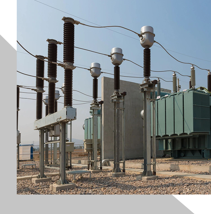 A group of electrical equipment sitting on top of a field.